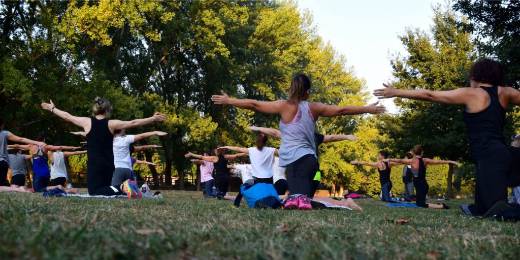 Women Practicing Yoga Outside