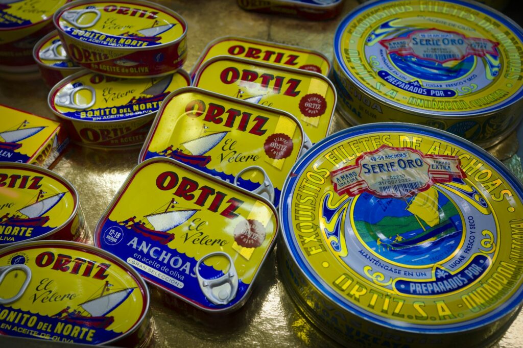 a group of tins of food sitting on top of a table