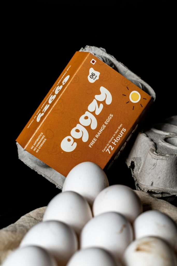 Close-up of free range eggs in eco-friendly packaging, emphasizing freshness and sustainability.