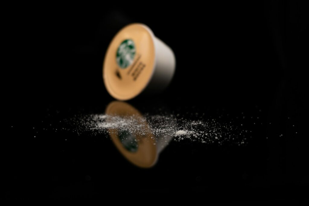 a starbucks coffee cup sitting on top of a table