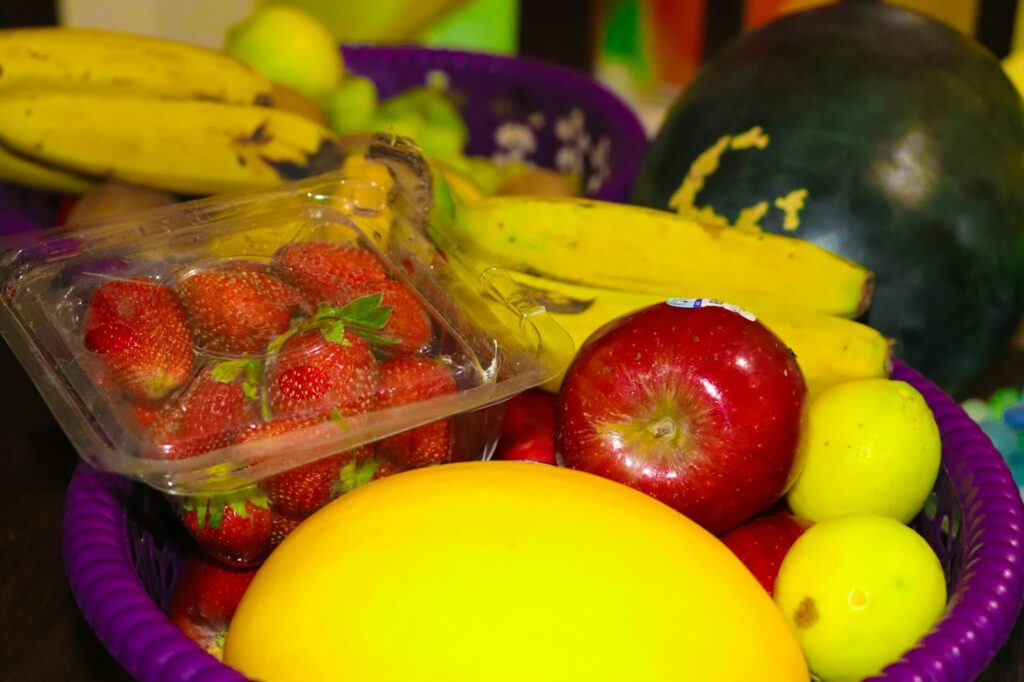 red strawberries on clear plastic container