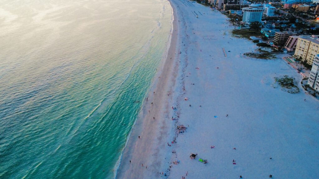 Aerial view of a stunning beach and buildings.