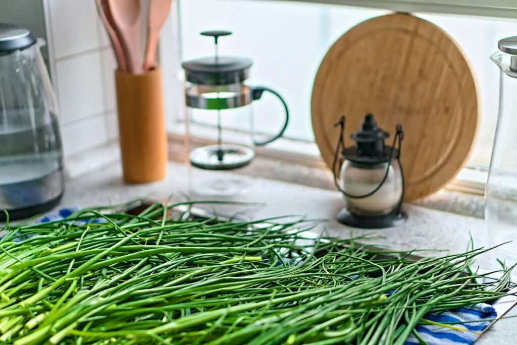 a pile of green beans sitting on top of a counter